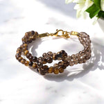 Load image into Gallery viewer, Smokey & Tiger Eye Knot Bracelet 4mm
