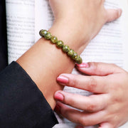 Peridot Bracelet In Round Beads